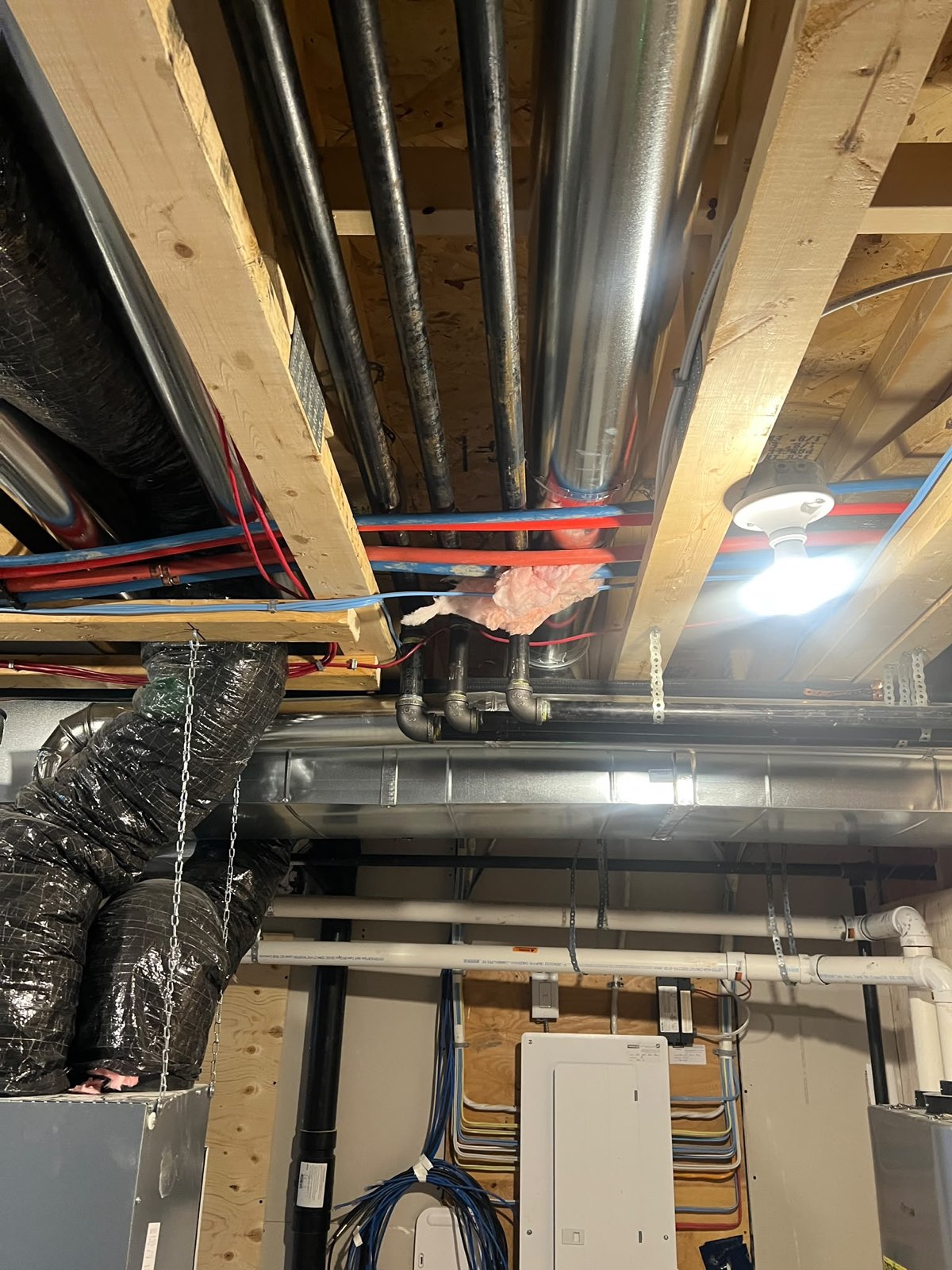 Basement mechanical rough-in with gas lines, water lines and ductwork