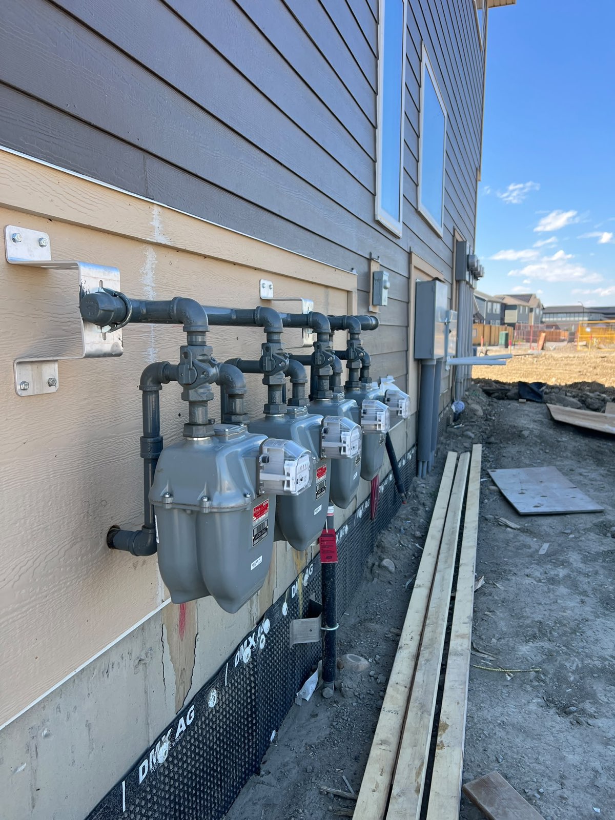 Multi-unit natural gas meter installation on a new Calgary build
